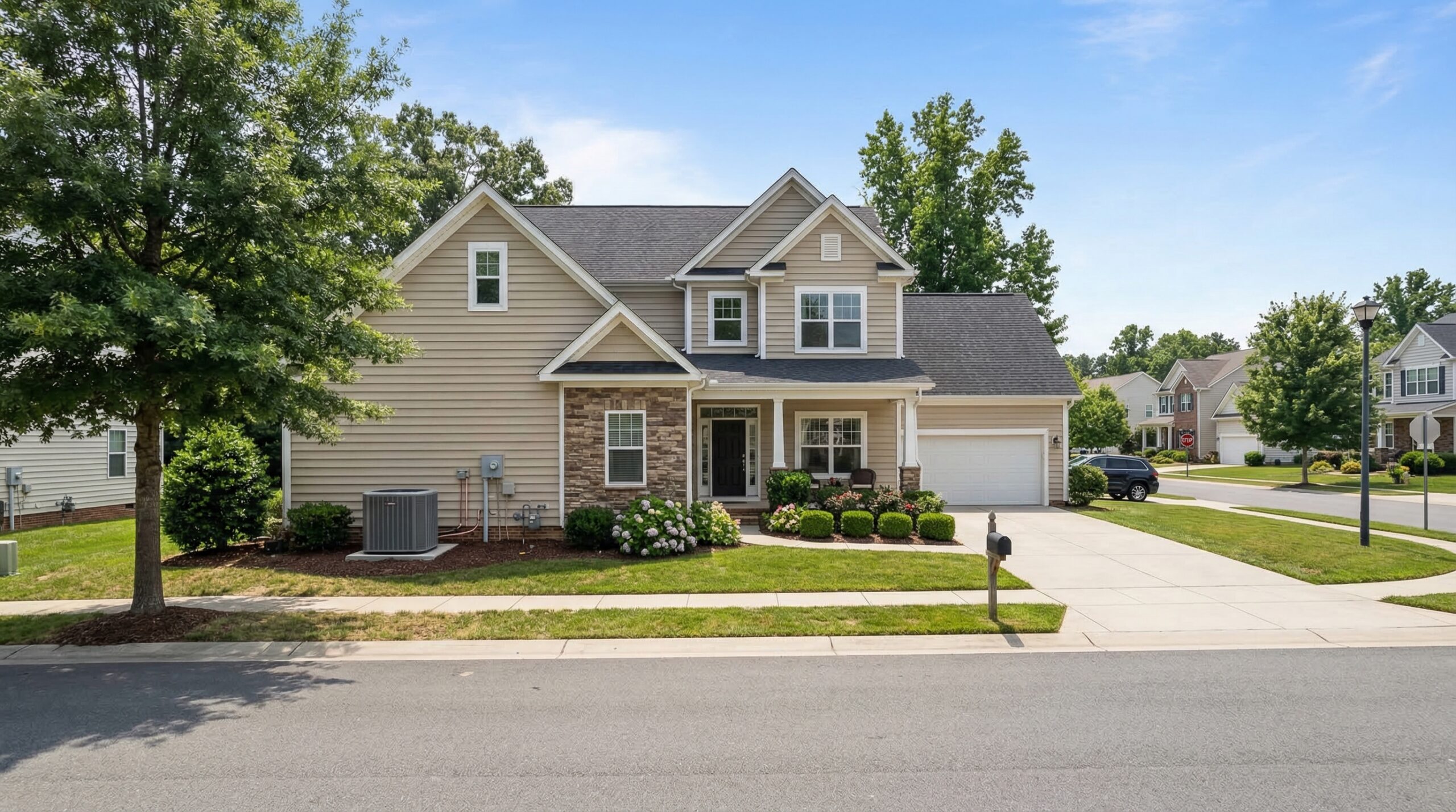 Suburban home with visible AC condenser unit on the side of the house